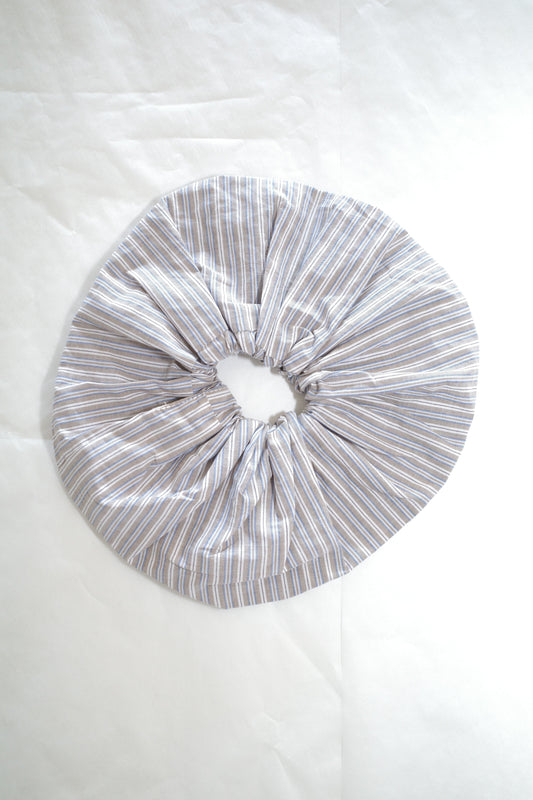 flat-lay image of the scrunchie by Deiji Studios in seas stripe

an oversized cotton elasticated scrunchie to be worn in hair or on wrist.

made from 100% organic cotton