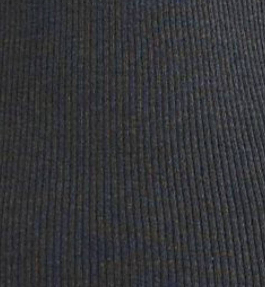 Close-up of a dark, ribbed lyocell fabric with vertical textured lines and evenly spaced ridges, from the Deiji Studios Ribbed Tank in Dark Charcoal. The material’s knit construction creates a distinctive tactile look.