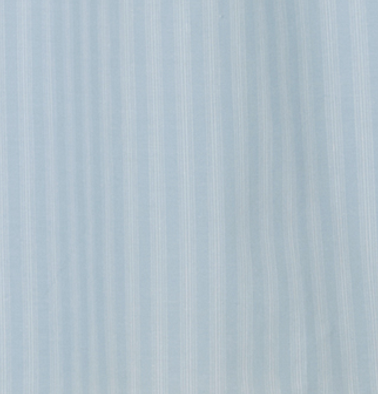 The Belted Skirt - Powder Blue Stripe features light blue fabric with subtle vertical white stripes, a smooth weave, and an understated pattern for effortless style.