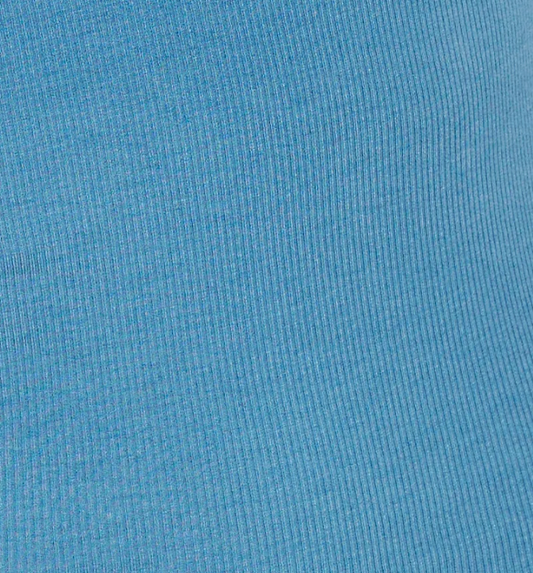 Close-up of the aqua ribbed fabric with vertical textured lines, showcasing a subtle pattern that highlights the stretch and weave—ideal for the Multi Button Top, designed as a long sleeve jersey with an asymmetric scoop neckline.