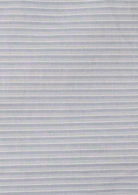 A close-up of the Layered Skirt - Sky Stripe by 0 shows light gray organic cotton fabric with thin, evenly spaced white horizontal stripes for a subtle, textured look.