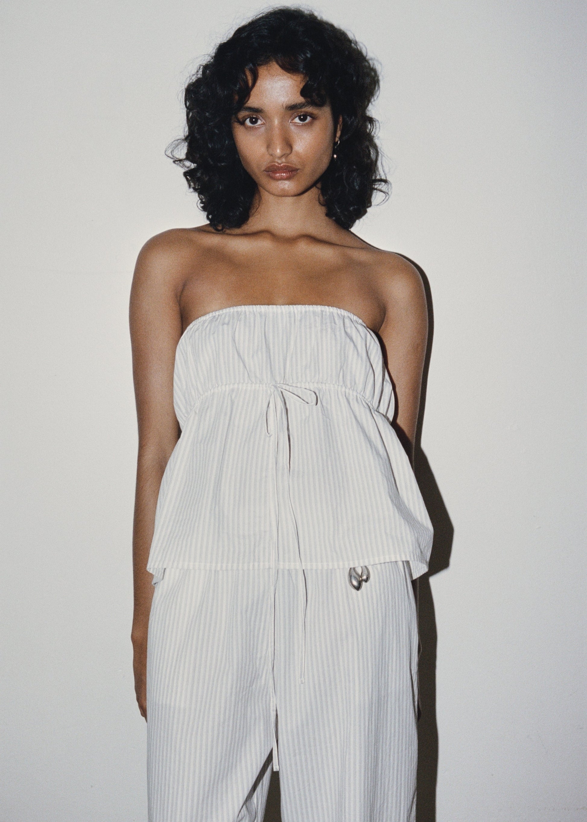 Female model wearing Strapless Cotton Top - Story Stripe by Deiji Studios against plain background