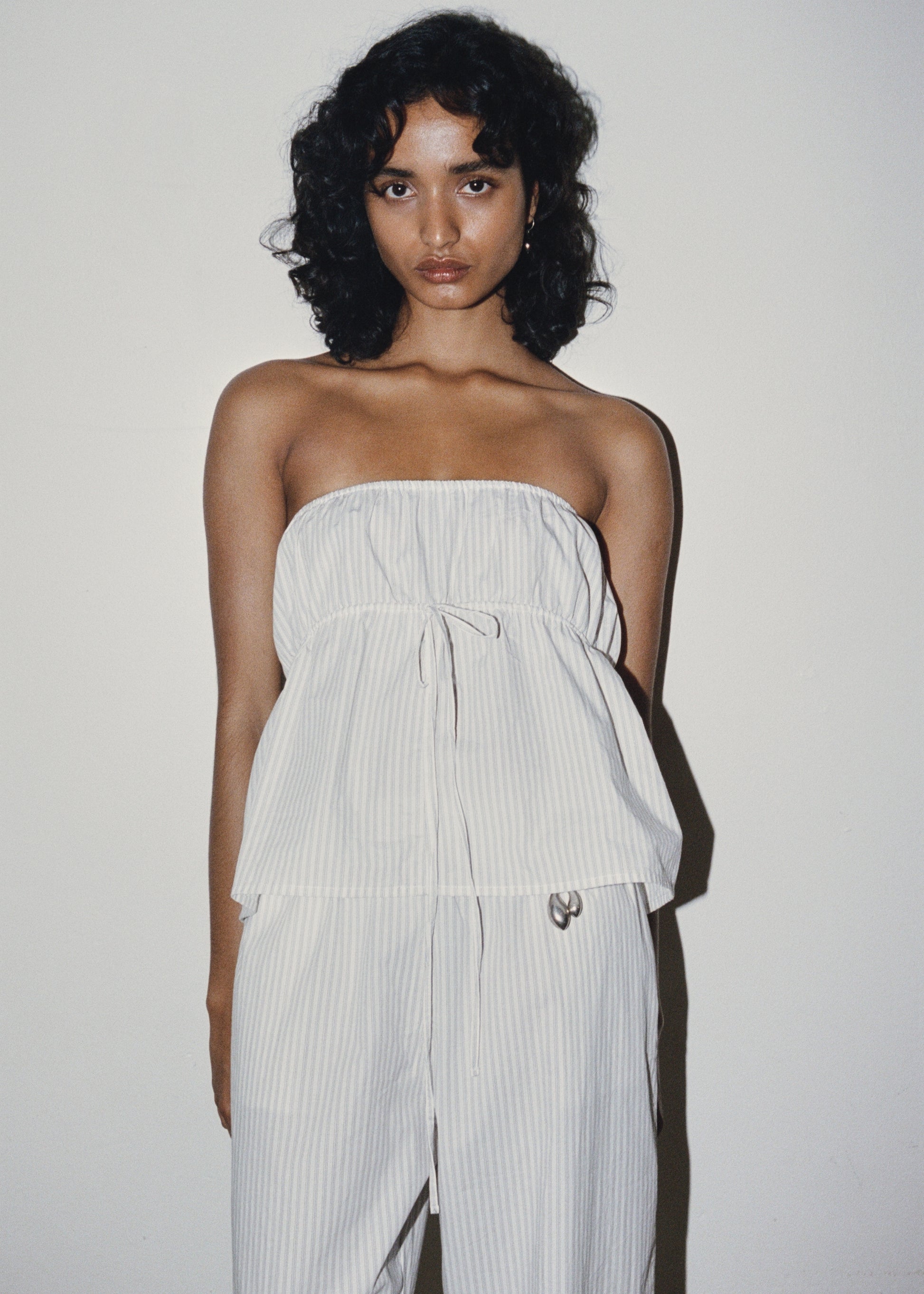 Female model wearing Strapless Cotton Top - Story Stripe by Deiji Studios against plain background