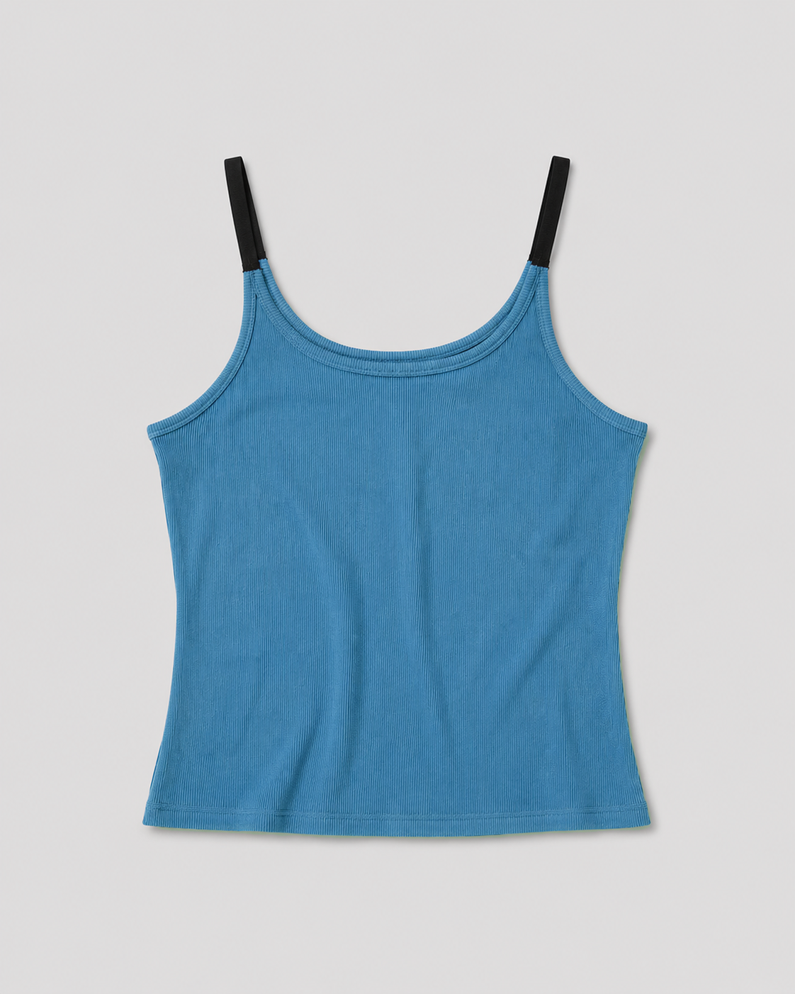 The Rib Jersey Tank - Azure is a blue fitted ribbed tank with thin black shoulder straps, displayed flat on a white background.