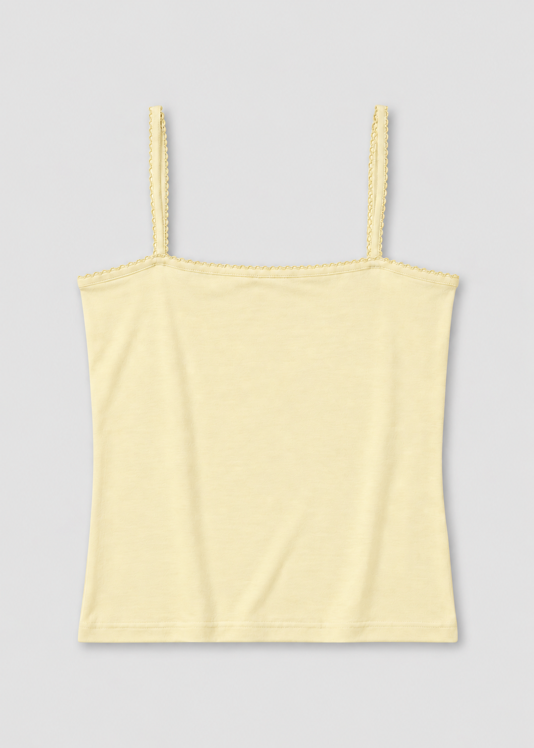 The Scallop Tank - Lemon by Deiji Studios laid flat against a plain white background, a fitted ribbed tank in lemon with fine shoulder straps and scallop trim along the straight neckline and straps.
